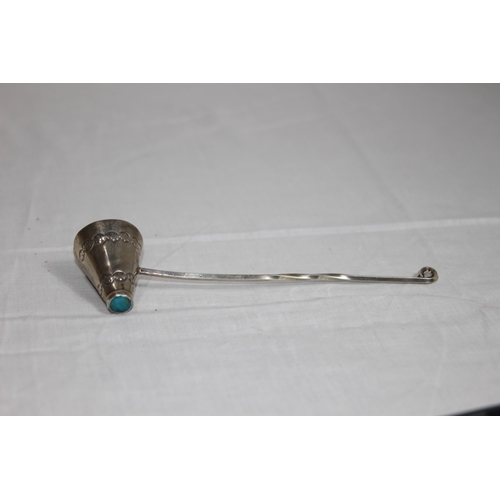 1081 - TURQUOISE MOUNTED SILVER CANDLE SNUFFER WITH NATIVE AMERICAN DESIGN - 23G