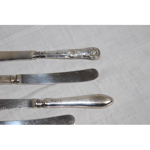 1094 - SELECTION OF SILVER SPOONS BOTH ENGLISH AND CONTINENTAL AND FOUR SILVER HANDLED KNIVES - VARIED MARK... 