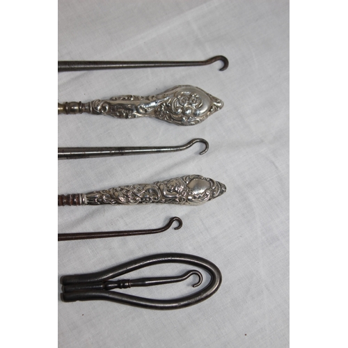 1106 - SELECTION OF FOUR SILVER HANDLED BUTTON HOOKS IN A VARIETY OF DESIGNS AND DATES AND OTHER BUTTON HOO... 