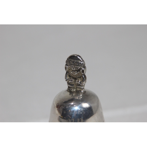 1109 - MEXICO OF SOUTH AMERICA WHITE METAL HANDBELL WITH FIGURAL HANDLE, MAKERS MARK TO THE CLANGER