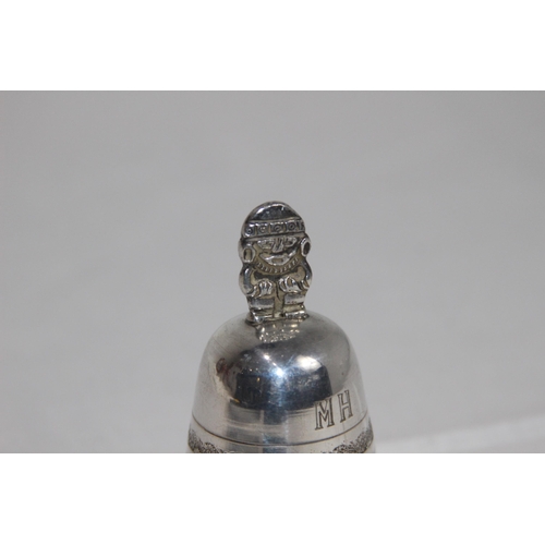 1109 - MEXICO OF SOUTH AMERICA WHITE METAL HANDBELL WITH FIGURAL HANDLE, MAKERS MARK TO THE CLANGER