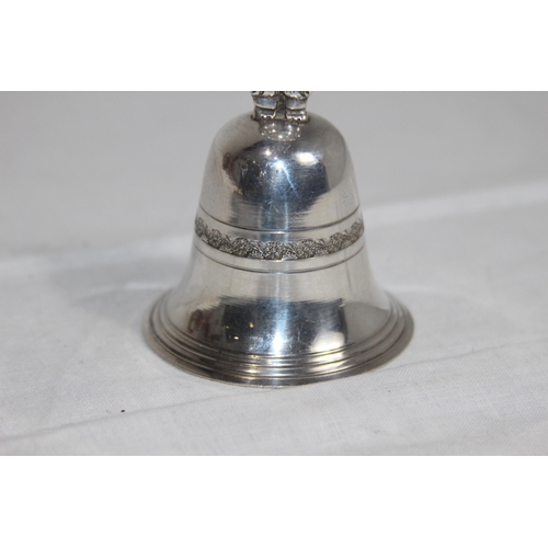 1109 - MEXICO OF SOUTH AMERICA WHITE METAL HANDBELL WITH FIGURAL HANDLE, MAKERS MARK TO THE CLANGER