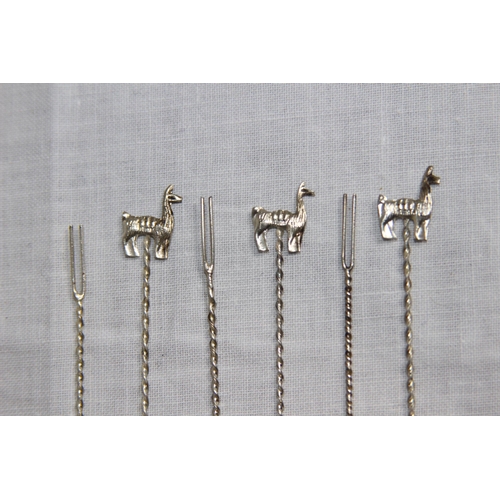 1124 - SET OF SIX LAMA MOUNTED SILVER COCKTAIL STICKS