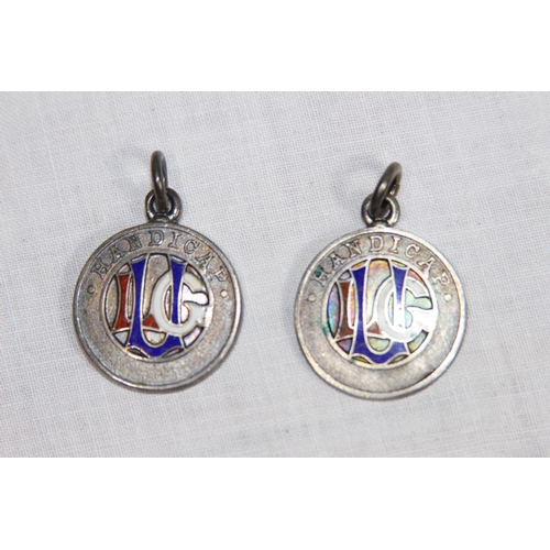 1127 - TWO SILVER AND ENAMEL GOLFING FOBS - LONDON 1922 AND BIRMINGHAM 1913 - GROSS WEIGHT 23G