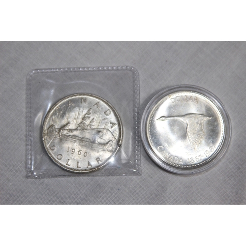 943 - TWO CANADA SILVER DOLLAR COINS