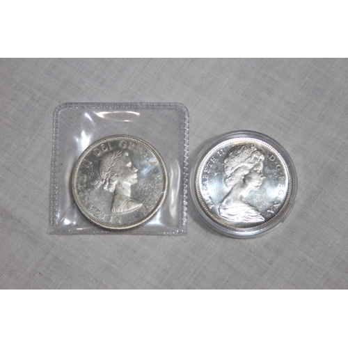 943 - TWO CANADA SILVER DOLLAR COINS