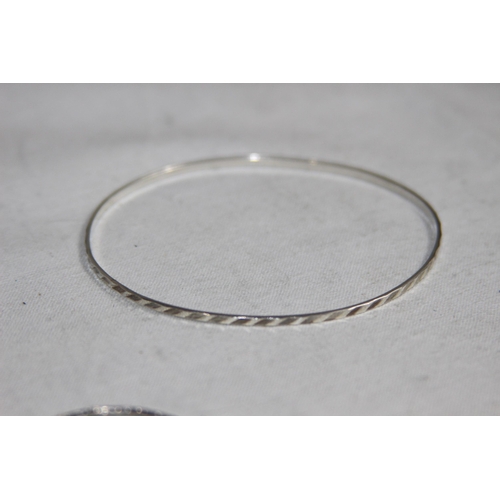 1009 - PAIR OF SILVER BRACELETS AND A BABY SILVER BRACELET