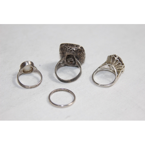 1012 - THREE SILVER RINGS AND A WHITE METAL WEDDING BAND RING