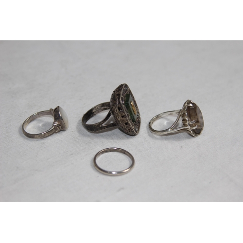 1012 - THREE SILVER RINGS AND A WHITE METAL WEDDING BAND RING