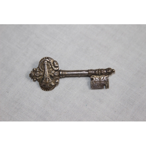 1020 - TWO FILIGREE SILVER BROOCHES AND A FRENCH KEY TO THE CITY, PARIS, WHITE METAL SILVER BROOCH