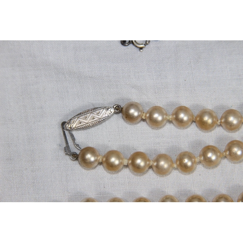 1028 - FANCY LINK SILVER CHAIN AND A SILVER CLASPED FAUX PEARL NECKLACE