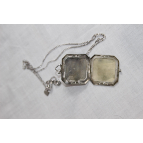 1032 - OCTAGONAL FORM SILVER LOCKET ON A SILVER CHAIN