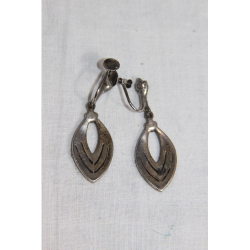 1034 - THREE PAIRS OF SILVER EARRINGS IN VARIED DESIGNS