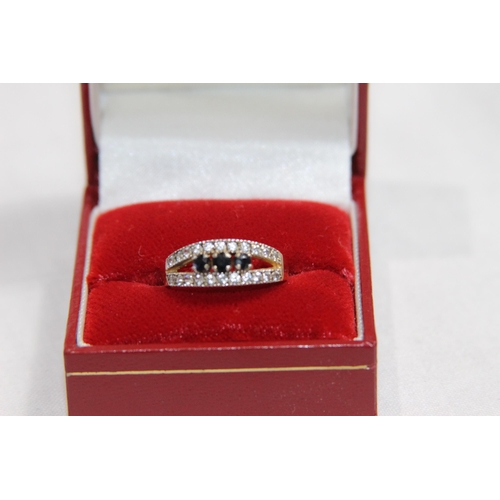 1181 - SAPPHIRE AND C2 SET 9CT GOLD RING - 2.32G - SIZE M