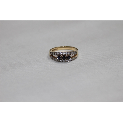 1181 - SAPPHIRE AND C2 SET 9CT GOLD RING - 2.32G - SIZE M