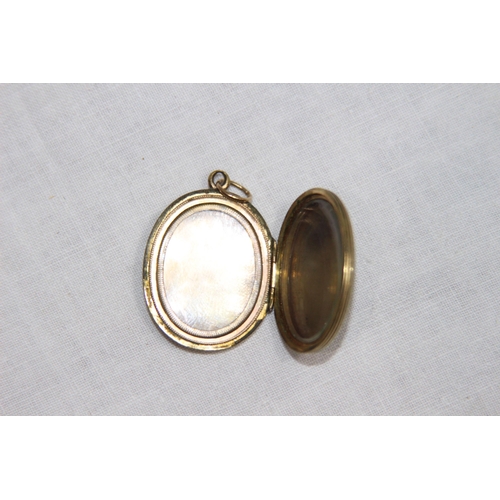 1190 - 9CT GOLD WRISTWATCH AND A YELLOW METAL LOCKET