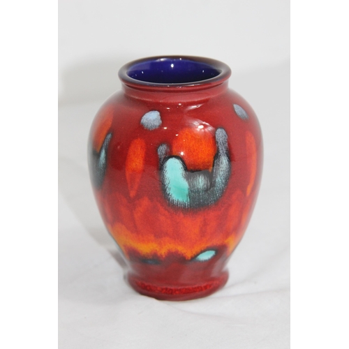 303 - POOLE VOLCANO BUD VASE 
10CM