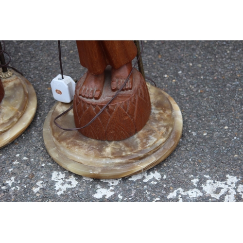 232 - VINTAGE LARGE PAIR OF FIGURAL THAI TEAK LAMPS ON A MARBLE BASE 
96CM