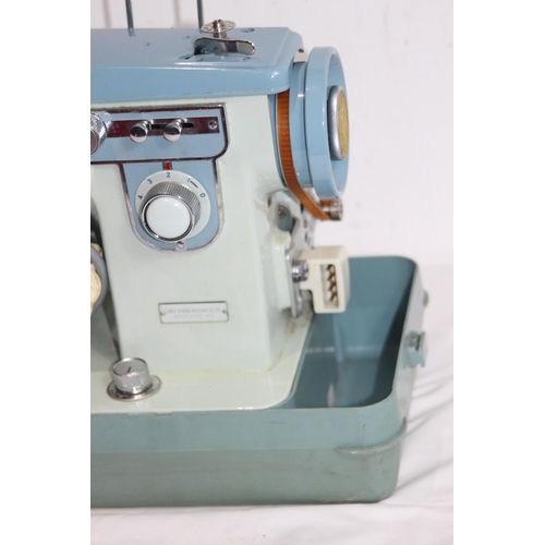 557 - VINTAGE JONES SEWING MACHINE