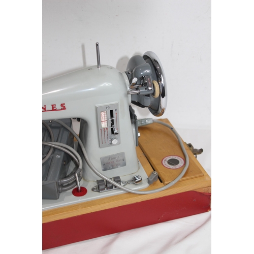 558 - VINTAGE JONES SEWING MACHINE