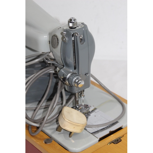 558 - VINTAGE JONES SEWING MACHINE