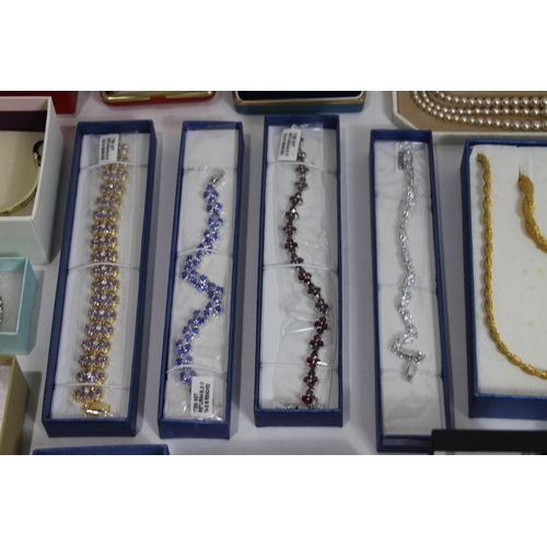 605 - QUANTITY OF BOXED COSTUME JEWELLERY