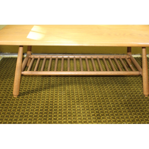 85 - BLONDE ERCOL COFFEE TABLE WITH MAGAZINE RACK 
103 X 50 X 36CM