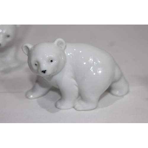 838 - 4 X PORCELIAN POLAR BEAR CUB FIGURES
9CM