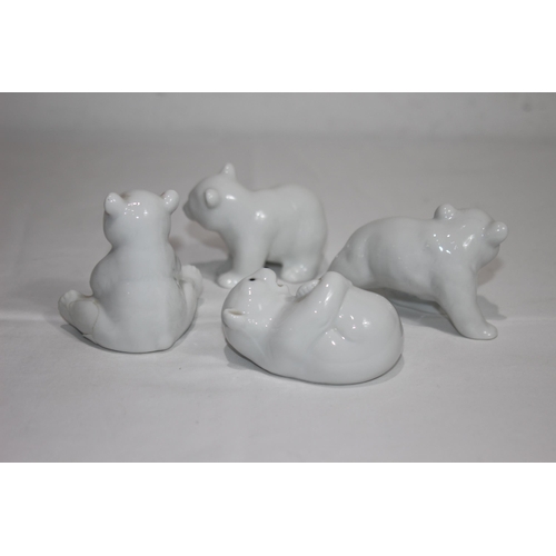 838 - 4 X PORCELIAN POLAR BEAR CUB FIGURES
9CM