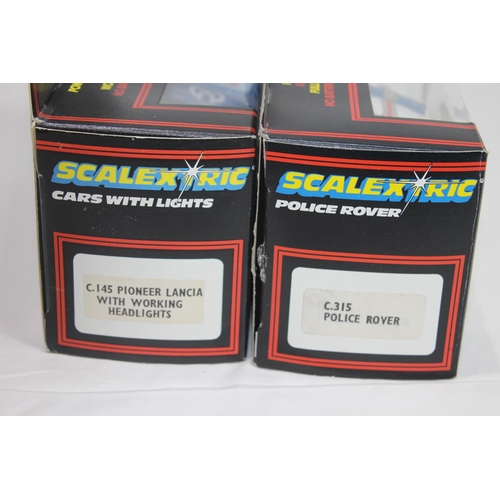 723 - 2 X BOXED VINTAGE SCALEXTRIC CARS WITH LIGHTS