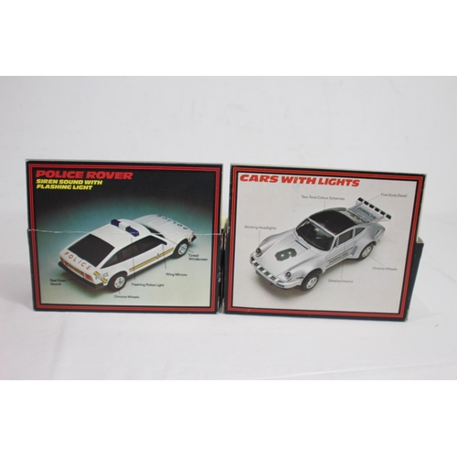 723 - 2 X BOXED VINTAGE SCALEXTRIC CARS WITH LIGHTS