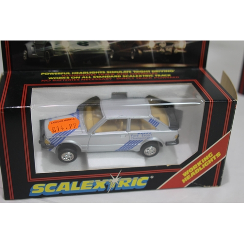 725 - 2 X BOXED VINTAGE SCALEXTRIC CARS WITH LIGHTS