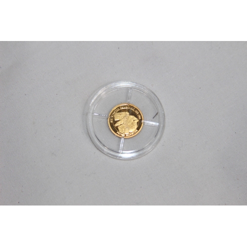 980 - .585 GOLD PROOF COIN - 0.5G