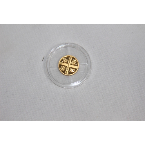 980 - .585 GOLD PROOF COIN - 0.5G