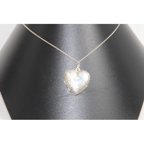 1045 - HEART SHAPED SILVER LOCKET ON SILVER CHAIN