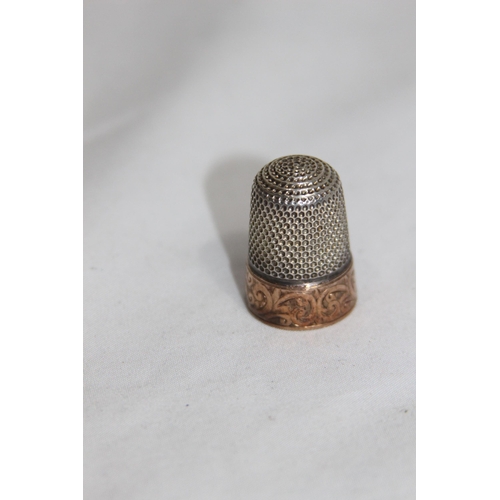 1135 - SILVER AND GOLD THIMBLE