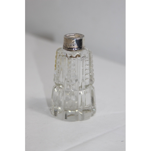 1143 - SELECTION OF FOUR SILVER COLLARED PERFUME BOTTLES, 3 WITH STOPPERS, VARIED DESIGNS AND DATES