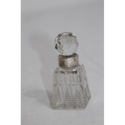 1143 - SELECTION OF FOUR SILVER COLLARED PERFUME BOTTLES, 3 WITH STOPPERS, VARIED DESIGNS AND DATES