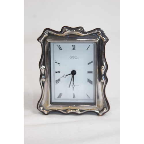 1145 - CASED R CARR SILVER FRAMED CLOCK WITH PAPERWORK - SHEFFIELD 1997