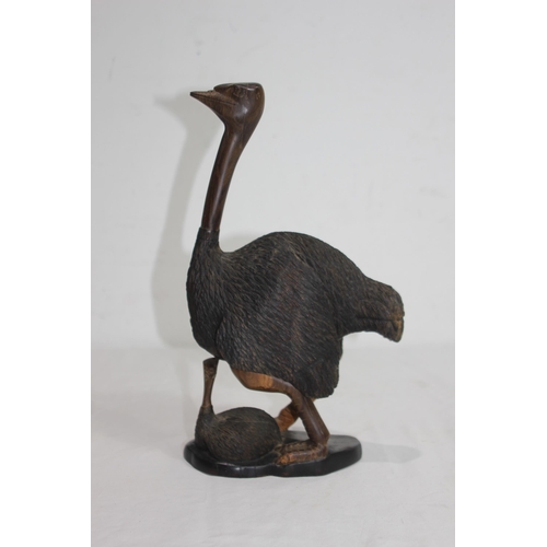 919 - CARVED WOODEN FIGURE OF OSTRICH AND ITS BABY SIGNED J. NGILA
30CM