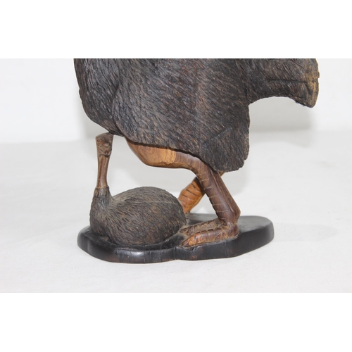 919 - CARVED WOODEN FIGURE OF OSTRICH AND ITS BABY SIGNED J. NGILA
30CM