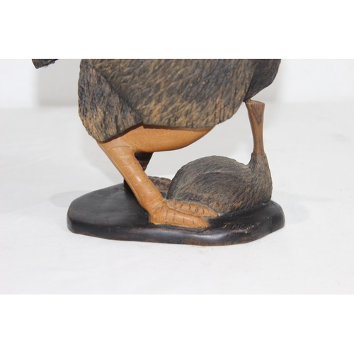 919 - CARVED WOODEN FIGURE OF OSTRICH AND ITS BABY SIGNED J. NGILA
30CM