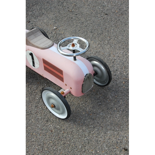 563 - TIN RIDE ON RACING CAR 
73 X 39CM