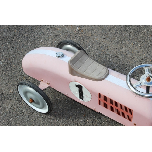 563 - TIN RIDE ON RACING CAR 
73 X 39CM