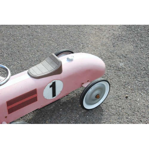 563 - TIN RIDE ON RACING CAR 
73 X 39CM