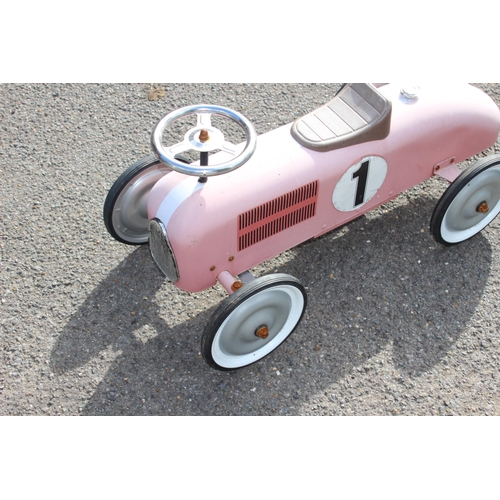 563 - TIN RIDE ON RACING CAR 
73 X 39CM