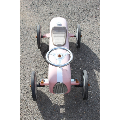 563 - TIN RIDE ON RACING CAR 
73 X 39CM