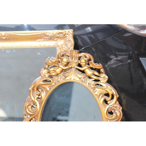 125 - 2 X ORNATE FRAMED MIRRORS 
76 X 59CM