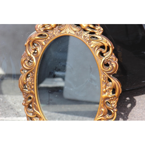 125 - 2 X ORNATE FRAMED MIRRORS 
76 X 59CM