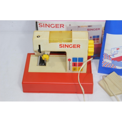 582 - CHILDS SINGER SEWING MACHINE IN BOX